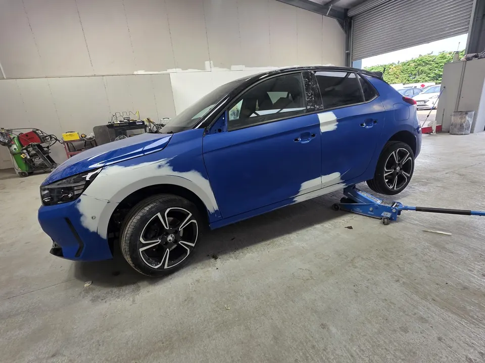 Blue car repaired - passenger side, before repair